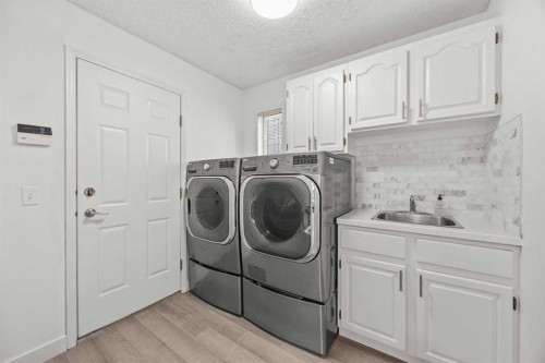 1360 Shawnee Road Sw, Calgary, AB - Indoor Photo Showing Laundry Room