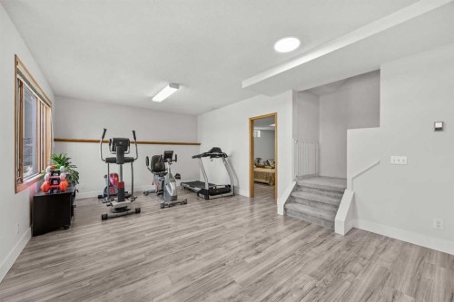 1360 Shawnee Road Sw, Calgary, AB - Indoor Photo Showing Gym Room