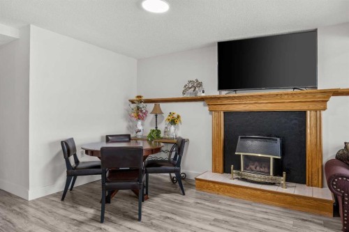 1360 Shawnee Road Sw, Calgary, AB - Indoor With Fireplace