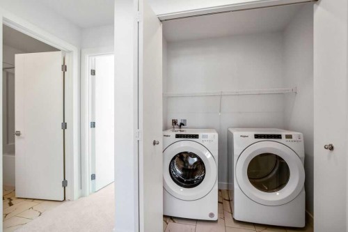 207-50 Cornerstone Passage Ne, Calgary, AB - Indoor Photo Showing Laundry Room