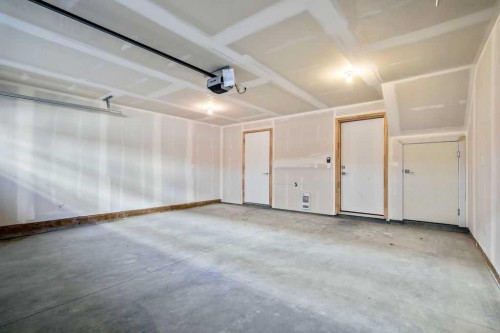 207-50 Cornerstone Passage Ne, Calgary, AB - Indoor Photo Showing Garage