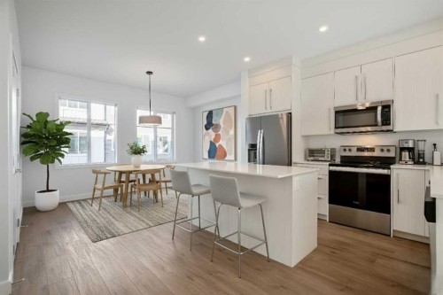207-50 Cornerstone Passage Ne, Calgary, AB - Indoor Photo Showing Kitchen With Stainless Steel Kitchen With Upgraded Kitchen