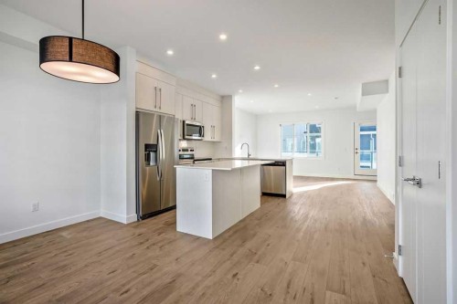 207-50 Cornerstone Passage Ne, Calgary, AB - Indoor Photo Showing Kitchen With Stainless Steel Kitchen With Upgraded Kitchen