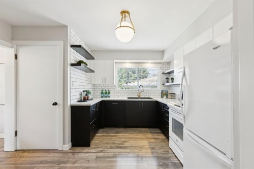 48 Haddock Road Sw, Calgary, AB - Indoor Photo Showing Kitchen With Upgraded Kitchen