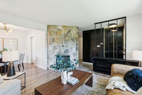 48 Haddock Road Sw, Calgary, AB - Indoor Photo Showing Living Room With Fireplace