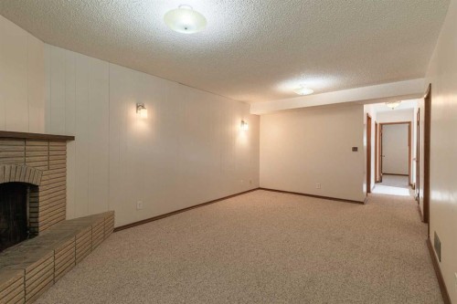 5222 Dalhousie Drive Nw, Calgary, AB - Indoor Photo Showing Other Room With Fireplace