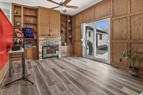 740 Canfield Place Sw, Calgary, AB - Indoor With Fireplace