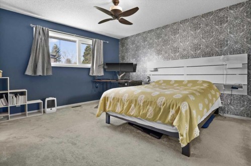 740 Canfield Place Sw, Calgary, AB - Indoor Photo Showing Bedroom
