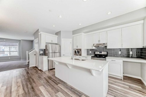 148 Howse Avenue Ne, Calgary, AB - Indoor Photo Showing Kitchen With Double Sink With Upgraded Kitchen