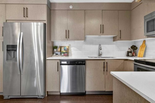 4403-302 Skyview Ranch Drive Ne, Calgary, AB - Indoor Photo Showing Kitchen With Stainless Steel Kitchen With Double Sink With Upgraded Kitchen