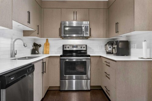 4403-302 Skyview Ranch Drive Ne, Calgary, AB - Indoor Photo Showing Kitchen With Stainless Steel Kitchen With Double Sink