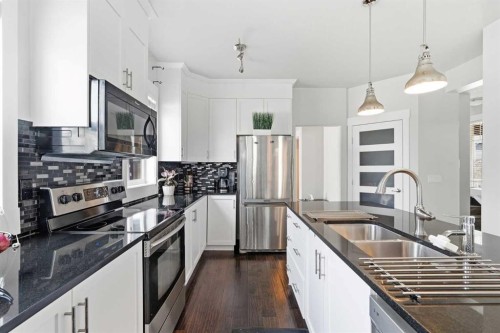 161 Rainbow Falls Glen, Chestermere, AB - Indoor Photo Showing Kitchen With Stainless Steel Kitchen With Double Sink With Upgraded Kitchen