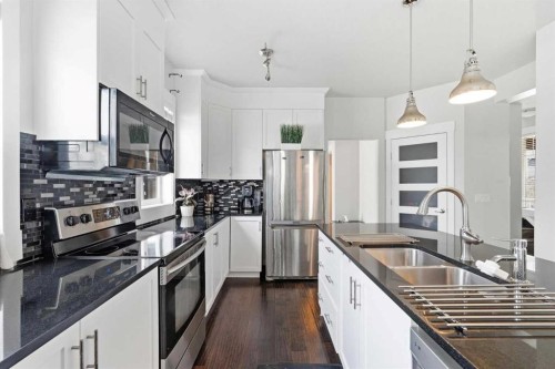 161 Rainbow Falls Glen, Chestermere, AB - Indoor Photo Showing Kitchen With Stainless Steel Kitchen With Double Sink With Upgraded Kitchen