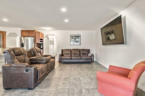 30 Drake Landing Common, Okotoks, AB - Indoor Photo Showing Living Room