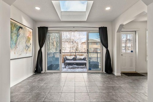 30 Drake Landing Common, Okotoks, AB - Indoor Photo Showing Other Room With Fireplace
