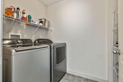 30 Drake Landing Common, Okotoks, AB - Indoor Photo Showing Laundry Room