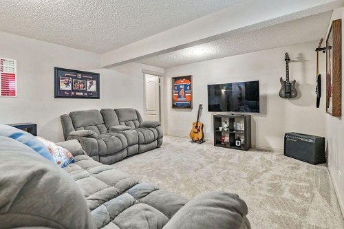 30 Drake Landing Common, Okotoks, AB - Indoor Photo Showing Living Room