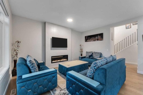 110 Waterford Road, Chestermere, AB - Indoor Photo Showing Living Room With Fireplace