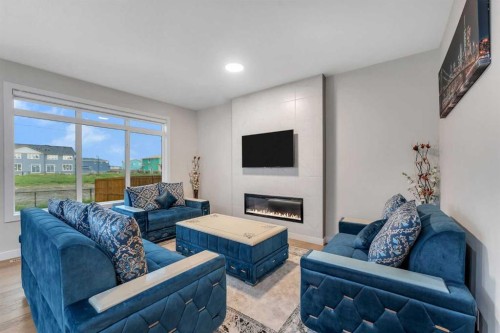 110 Waterford Road, Chestermere, AB - Indoor Photo Showing Living Room With Fireplace