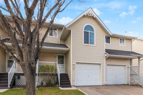 45-567 Edmonton Trail Ne, Airdrie, AB - Outdoor With Facade
