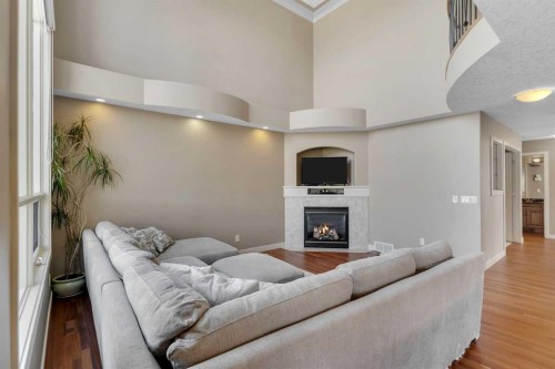 273 Everglade Circle Sw, Calgary, AB - Indoor Photo Showing Living Room With Fireplace