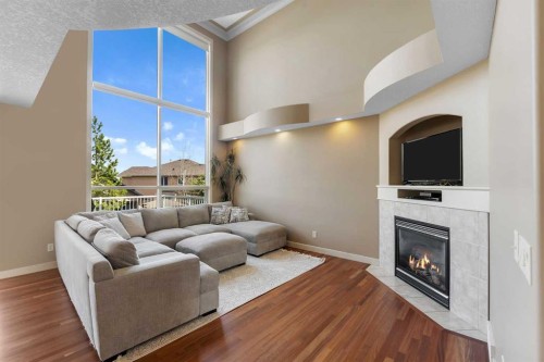 273 Everglade Circle Sw, Calgary, AB - Indoor Photo Showing Living Room With Fireplace