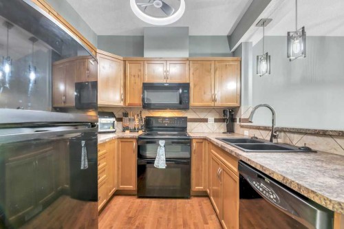 8-172 Rockyledge View Nw, Calgary, AB - Indoor Photo Showing Kitchen With Double Sink