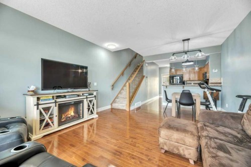 8-172 Rockyledge View Nw, Calgary, AB - Indoor Photo Showing Living Room With Fireplace