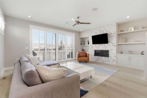 2024 36 Avenue, Calgary, AB - Indoor Photo Showing Living Room With Fireplace