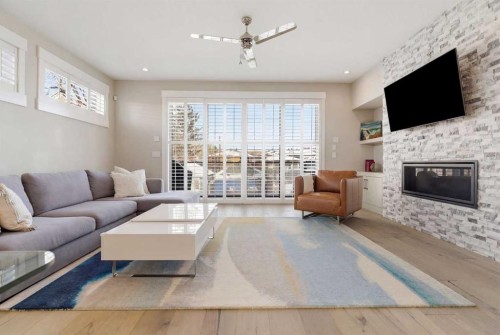 2024 36 Avenue, Calgary, AB - Indoor Photo Showing Living Room With Fireplace