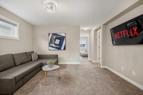 166 Howse Common Ne, Calgary, AB - Indoor Photo Showing Living Room