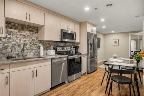 166 Howse Common Ne, Calgary, AB - Indoor Photo Showing Kitchen With Double Sink
