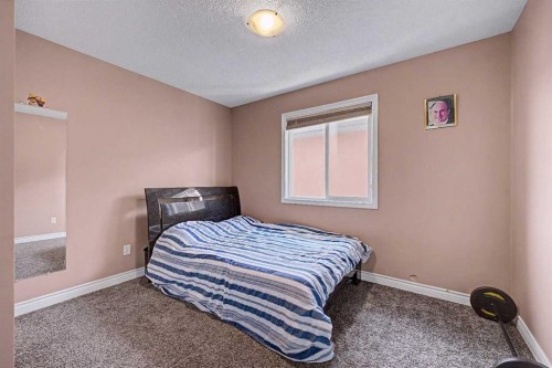 644 Luxstone Landing Sw, Airdrie, AB - Indoor Photo Showing Bedroom