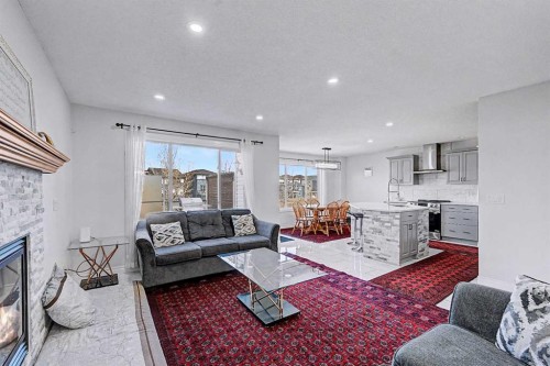 644 Luxstone Landing Sw, Airdrie, AB - Indoor Photo Showing Living Room With Fireplace