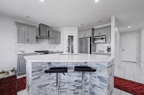 644 Luxstone Landing Sw, Airdrie, AB - Indoor Photo Showing Kitchen With Upgraded Kitchen