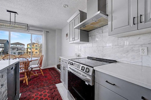 644 Luxstone Landing Sw, Airdrie, AB - Indoor Photo Showing Kitchen With Upgraded Kitchen