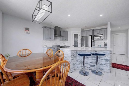 644 Luxstone Landing Sw, Airdrie, AB - Indoor Photo Showing Dining Room