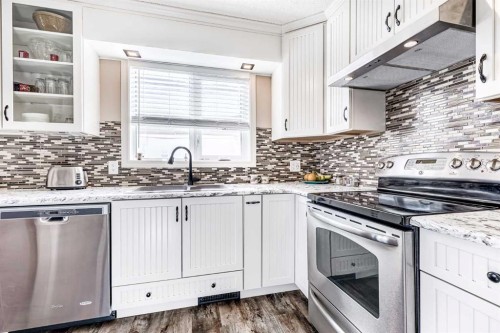 79 Macewan Meadow Way Nw, Calgary, AB - Indoor Photo Showing Kitchen With Upgraded Kitchen