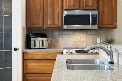 57 Thornfield Close Se, Airdrie, AB - Indoor Photo Showing Kitchen With Double Sink