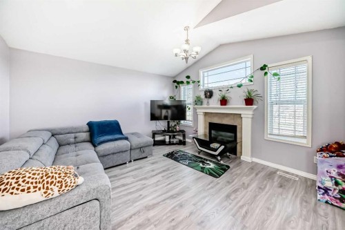 44 Canoe Square Sw, Airdrie, AB - Indoor Photo Showing Living Room With Fireplace