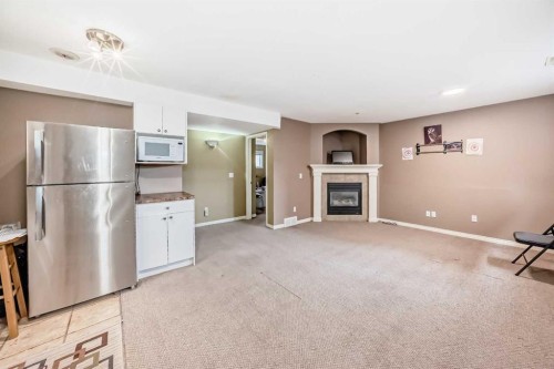 44 Canoe Square Sw, Airdrie, AB - Indoor With Fireplace