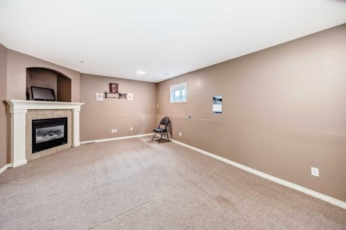 44 Canoe Square Sw, Airdrie, AB - Indoor With Fireplace