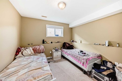 44 Canoe Square Sw, Airdrie, AB - Indoor Photo Showing Bedroom