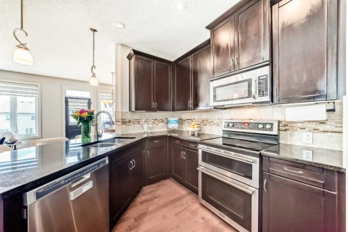 70 Sage Berry Way Nw, Calgary, AB - Indoor Photo Showing Kitchen With Stainless Steel Kitchen With Double Sink With Upgraded Kitchen
