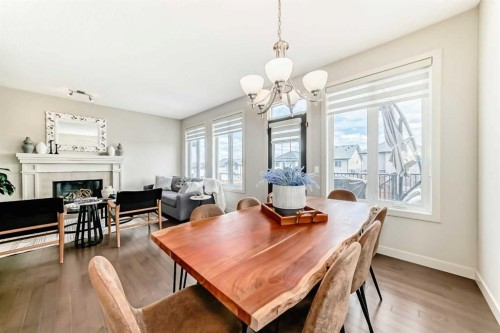 70 Sage Berry Way Nw, Calgary, AB - Indoor Photo Showing Dining Room With Fireplace