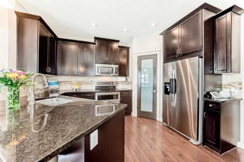 70 Sage Berry Way Nw, Calgary, AB - Indoor Photo Showing Kitchen With Stainless Steel Kitchen With Double Sink With Upgraded Kitchen