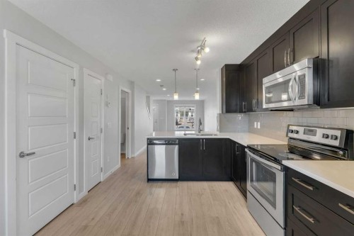 616 Cranford Mews Se, Calgary, AB - Indoor Photo Showing Kitchen With Upgraded Kitchen