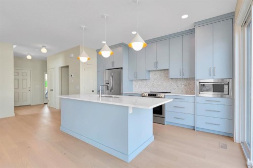 96 Fireside Common, Cochrane, AB - Indoor Photo Showing Kitchen With Upgraded Kitchen