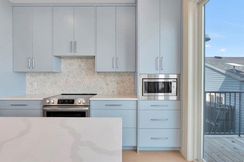 96 Fireside Common, Cochrane, AB - Indoor Photo Showing Kitchen With Upgraded Kitchen