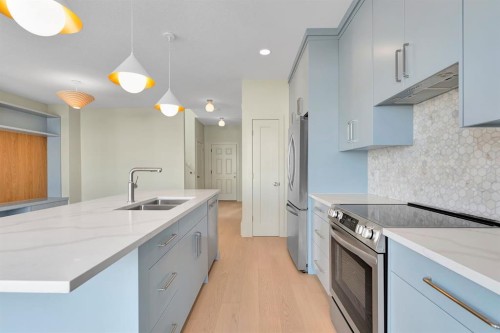 96 Fireside Common, Cochrane, AB - Indoor Photo Showing Kitchen With Double Sink With Upgraded Kitchen